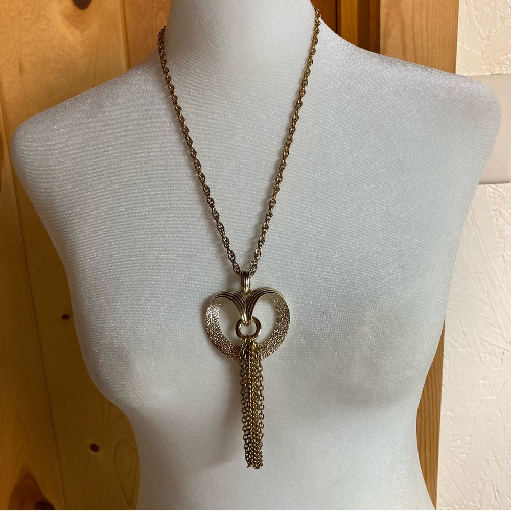 Vintage Coventry gold tone heart pendant and chain of 22” logo on the back